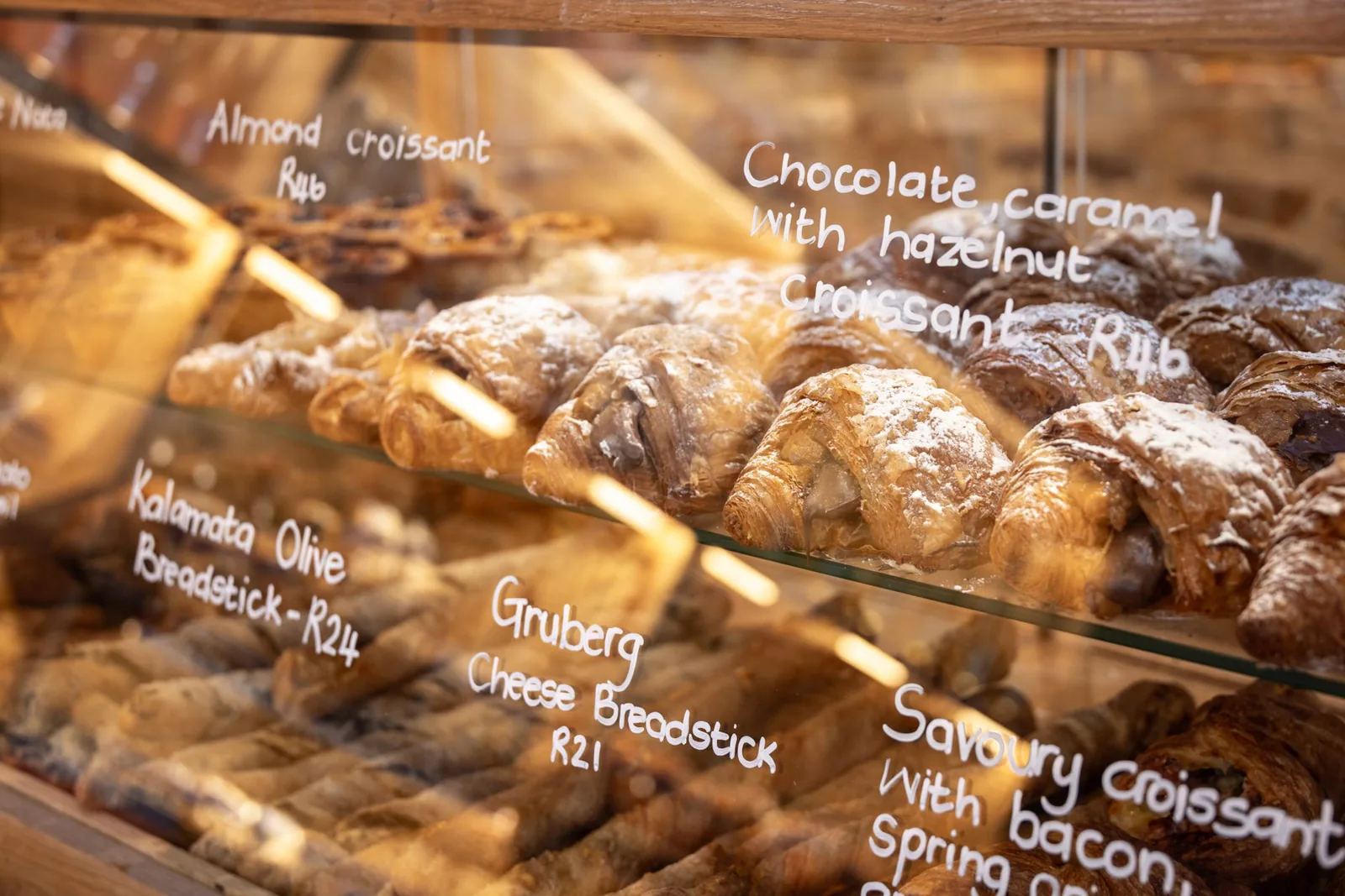 Close-up of assorted croissants and pastries in bakery showcase